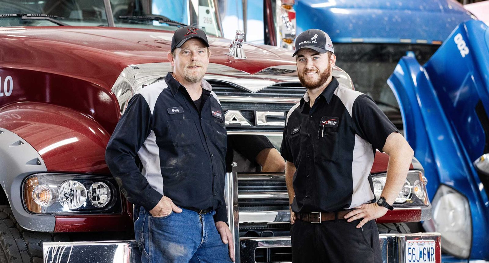 Nextran Employees in front of Mack truck